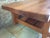PIERRE CHAPO, Coffee table in solid elm, rectangular in shape, suspended, sliding drawer, opening on both sides. This...