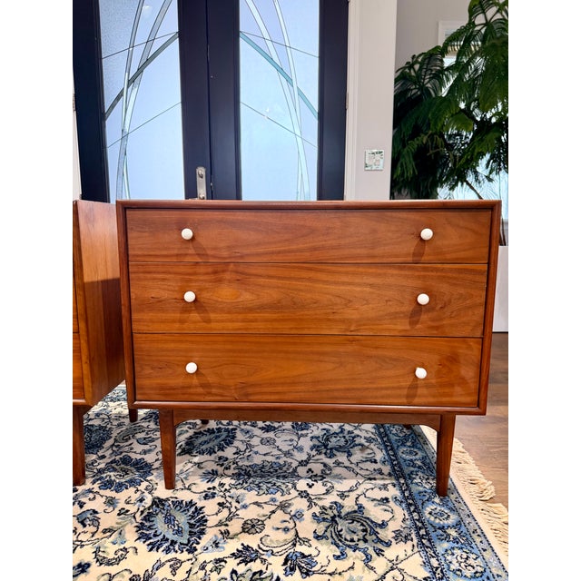 An exceptional matched pair of Drexel “Declaration” 3-drawer dressers, designed by Kipp Stewart and Stewart MacDougall in...