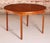 Mid century round extending teak dining table by mcintosh, circa 1970s. A butterfly extension leaf stored underneath....