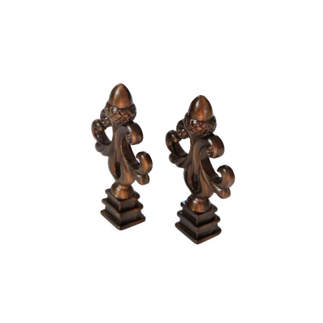 A pair of antiqued brass acorn scrolled lamp finials. Fits a standard size lamp harp. Dimensions per finial. We have more...