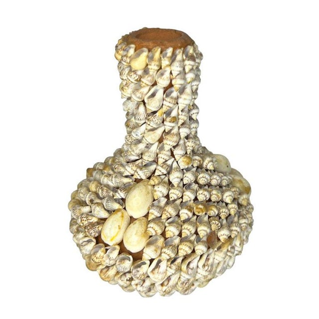 This stunning vintage shell-encrusted bud vase is an exquisite piece of coastal artistry perfect for lovers of seashell...
