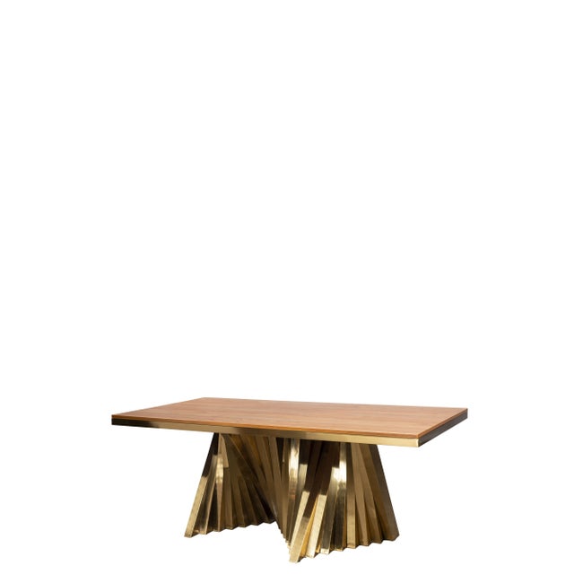 Modern gold stainless steel rectangle dining table has a wood top. It can seat 8 people. Care Instructions: Dust with a cloth
