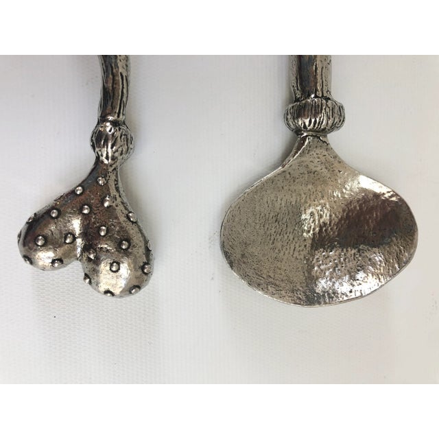 Pair of whimsical serving fork and spoon by Patrick Meyer. Patrick Meyer Studios is known for elegant designs for his...