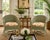 A delightful pair of vintage wicker tub armchairs finished in a softly weathered sage green paint with the warm natural...