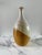 A signed vintage studio ceramic bottle form vase with an attractive layered natural tan - brown - off-white dipped glaze....