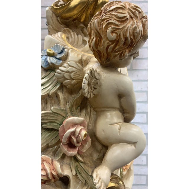 Vintage Italian Rococo Hand Carved and Painted Cherub/Angel Grandfathers Clock Featuring an Italian Rococo style hand...