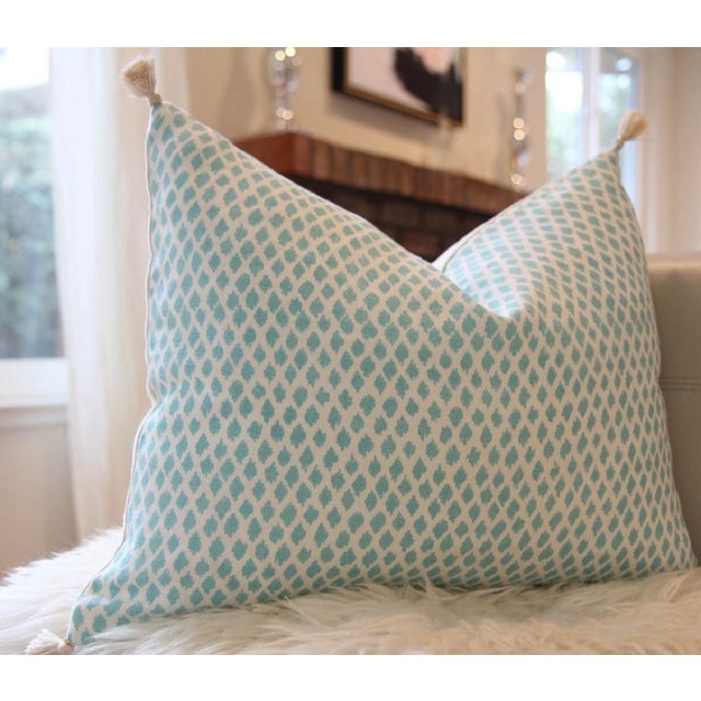 A hand-blocked linen-cotton pillow in Kamala aqua print by designer John Robshaw — a subtle, elegant accent that pairs...