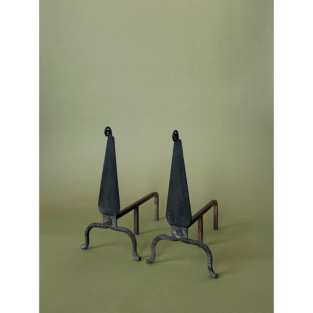 A pair of hand-forged wrought iron scrollwork andirons. Beautiful addition to your firescape.