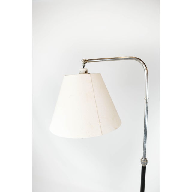 Floor lamp of chrome and black painted metal of Danish design from the 1970s. The lamp is in great vintage condition....