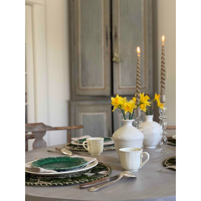 19th c painted French corner cabinet, in two pieces. The upper piece may have been added at a later date (20th c). This...