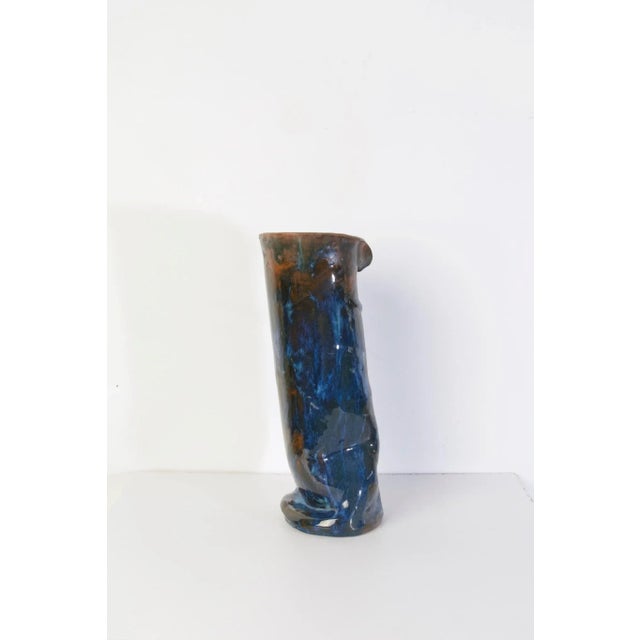 Studio handmade ceramic vase in blue and brown glaze. Marked underneath with the initials A.M. 1969.