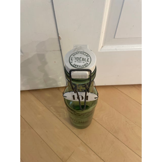 The French antique L'ideale bottle with a porcelain top is a rare and sought-after collectible item. This bottle features...