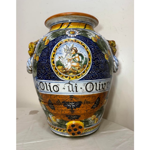 This monumental antique handmade Italian majolica, painted terracotta oilve vase is a unique and exquisite piece of...