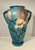 Offered for sale is a stunning and massive vintage Roseville Pottery floor vase featuring the highly sought-after Magnolia...