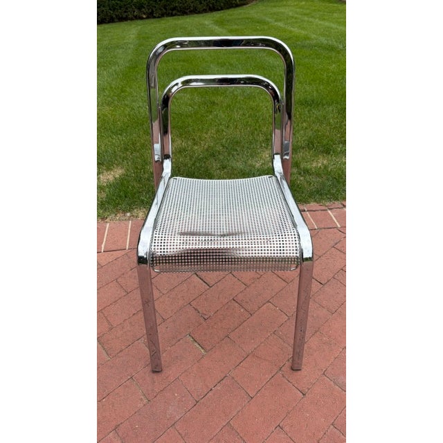 Arrben Chrome Dining Chair with Perforated Steel Seat, Italy, circa 1970s A sleek and sophisticated dining chair by...