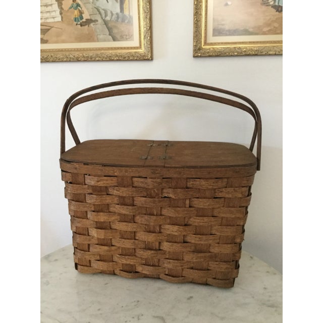 Offering a beautiful early 20th century oak picnic basket with hinged lid This gorgeous basket is in excellent antique...