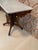 Here we have a fabulous antique Victorian parlor table. This beauty has a marble top, porcelain wheels, wonderful spoon...