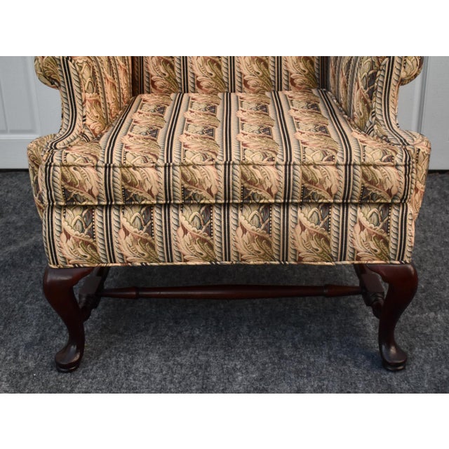 Vintage (1980's) Wing Chair has a Traditional - Queen Anne Style. Mahogany Frame in a Dark Reddish Brown Finish with...