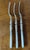 Elegant English serving forks featuring mother of pearl handles and silver plated chafing dish ferrules in classic style....