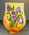 Orange colored background with purple and yellow flowers and a sleek form design. Marked to bottom I.V.W for Ivory White...