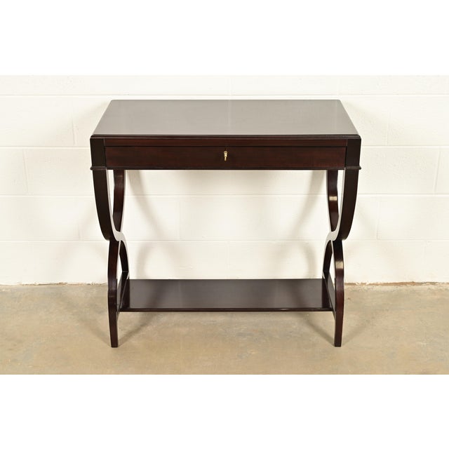 An exceptional Modern Regency or Art Deco style dark mahogany writing desk, console, or sofa table In the manner of...
