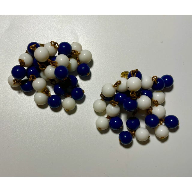 This is part of Chairish’s Costume Jewelry assortment. Fun and playful, these 1950s swirl earrings move when you move with...