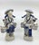 Vintage blue and white chinoiseie man and woman fishing couple. The couple carry two buckets that hang on each side. The...