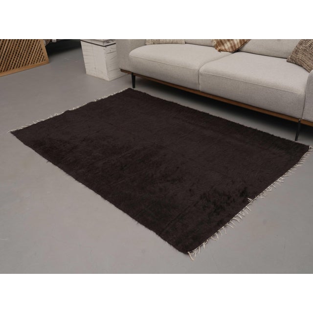 Vintage Hand-Knotted area rug is a semi-antique vintage area rug. The '70s Eastern region of Anatolia's unique rug is...