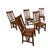 A handsome set of six vintage Mission-style oak dining chairs, American made circa 1990s, offering the substantial...