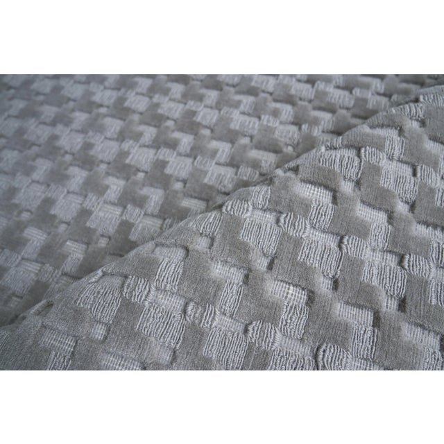 The versatility of a solid color rug with a little more intrigue. A mix of high and low geometric shapes gives the Monroe...