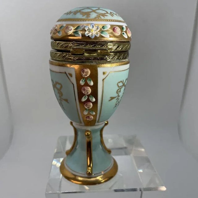 Limoges Style Egg Shaped Triket Box on Stand, 20th century H. 4.5 in. x 2 in. Diam. If you would like more information,...