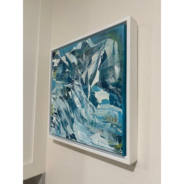 “Between Silence and Surge” is a dynamic 12” x 12” acrylic abstract framed painting that captures the restless energy of...