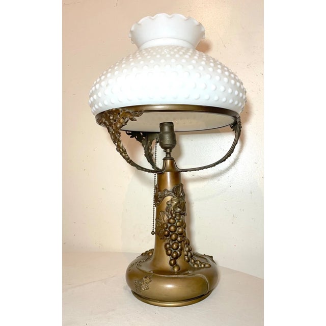 This exquisite table lamp is a lovely antique, with a beautiful grape pattern in high relief that adds a touch of elegance...