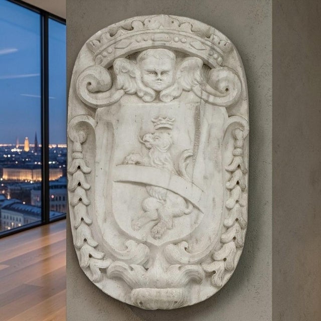 Carved from a single block of solid Carrara marble, this exceptional 17th century French heraldic crest was discovered in...