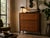 Beautiful Mid-Century Modern highboy by John Stuart Inc., featuring the distinctive “Facade” design with a warm wood...