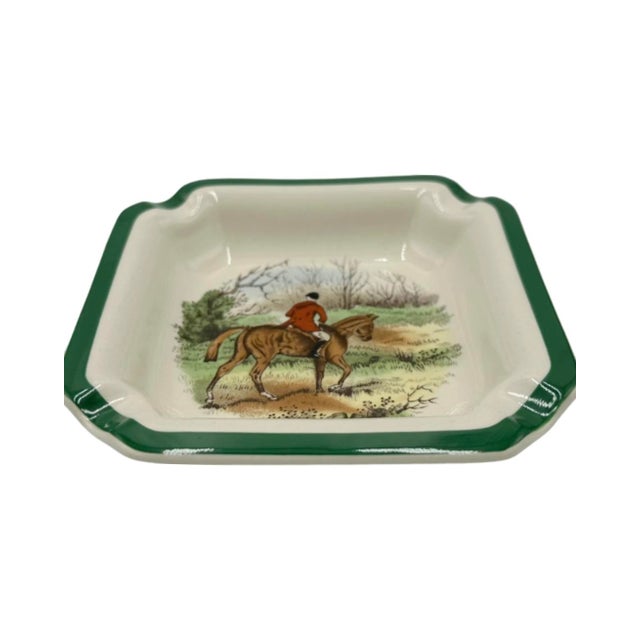 Details: -Charming ashtray dish has a lovely green trim and a lovely illustration of a man wearing traditional riding...