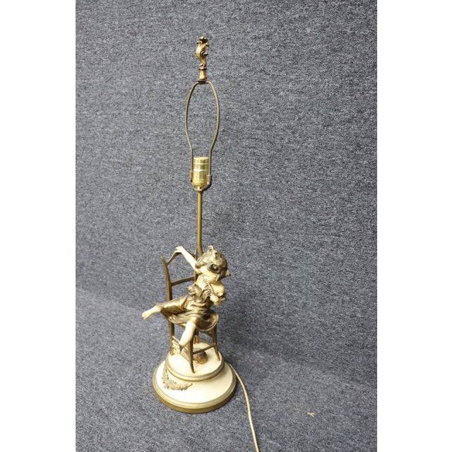 Gilded lamp of child and kitten. 32.5 total height 23" without harp