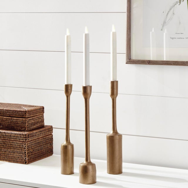 In a solid antique brass, these candleholders are substantial pieces. Pair with our LightLi tapers and create a glowing...