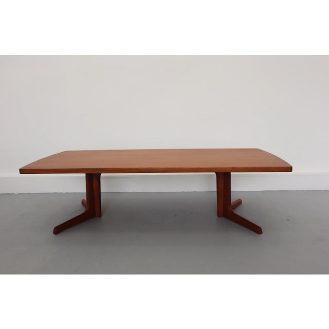 This coffee table was designed and manufactured by Skovby in Denmark in the 1960s. It is made of teak and has two...
