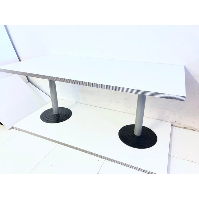 Rectangular, heavy table in the Memphis style from the 1960s, designed by Antonioa Astori for Driade. Wood, painted white...