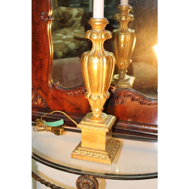 Modern 22 k. gold leaf designer lamp. This piece is sure to bring charm to your home.