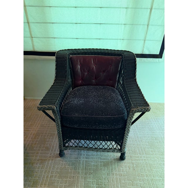 A beautiful antique Heywood Wakefield Bar Harbor style wicker lounge chair. Dramatic in its black rattan finish with...