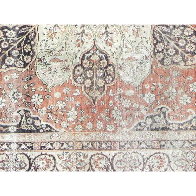 This antique Turkish Oushak Rug is crafted from luxurious Swaz-wool on cotton, blending beauty and comfort. At 9'8" x 13',...