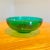 Large glass bowl in a beautiful teal green color. Great for storing fruit, as a serving bowl, or simply as decor.