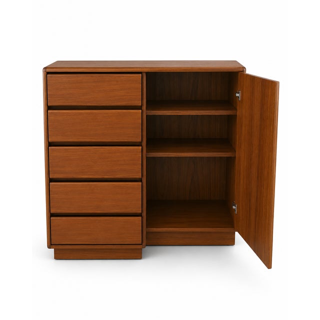 This is a Mid-Century Modern Teak Gentleman's Chest by Sannemanns Møbelfabrik, featuring five drawers and a shelved...