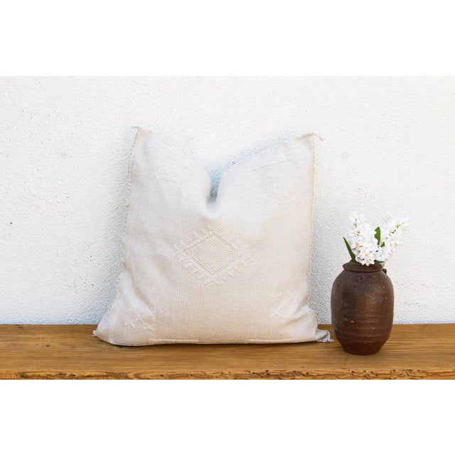 Indulge in the quiet beauty of this handcrafted Moroccan cactus silk pillow, measuring a generous 24 inches square. Woven...