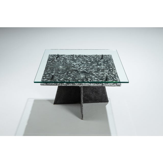 This heavy cast aluminium brutalist coffee table is a striking statement piece that merges sculptural form with raw...