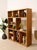 A substantial vintage bookcase with a wonderfully architectural open-grid design and warm natural oak finish. The...