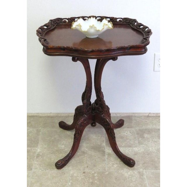 Antique Rococo Revival Carved Mahogany Occasional Table This exceptionally ornate mahogany occasional table is a...