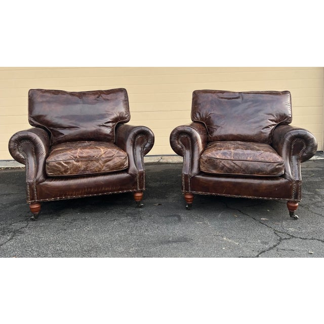 These unmarked Vintage English Leather Club Chairs have a beautiful patina from aged cigar leather that shows variations...